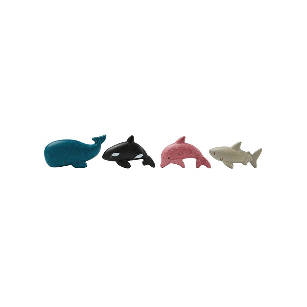 Four toy sea animals on a white background