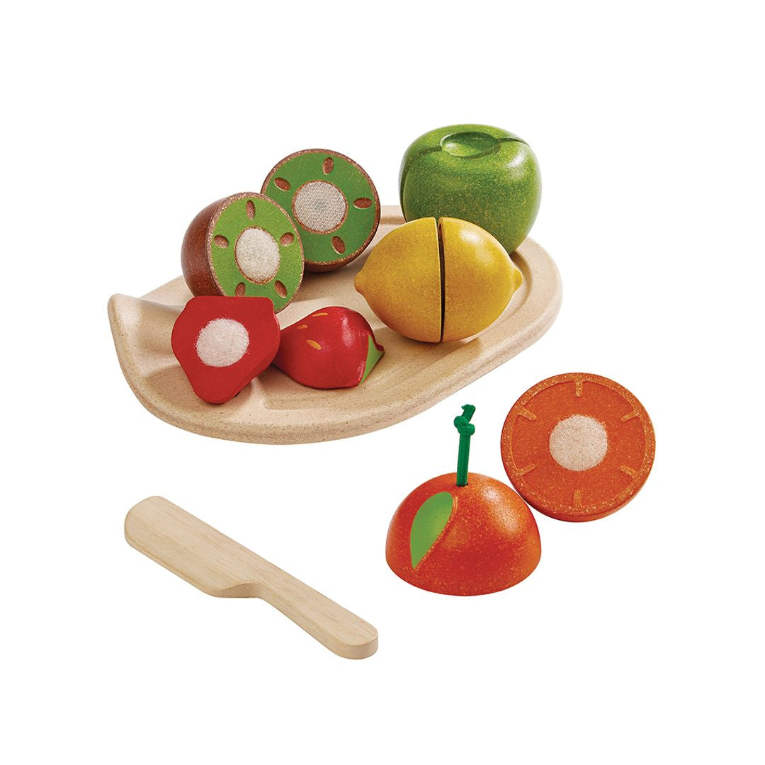 Set of wooden fruit toys on a white background
