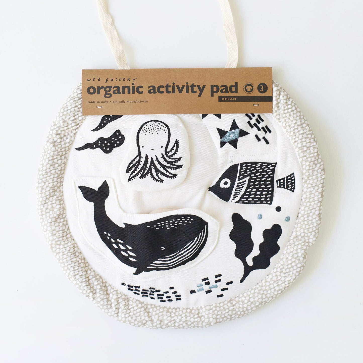 Organic activity pad with ocean-themed design on a white background
