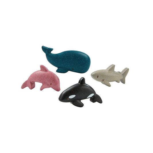 Four toy marine animals on a white background
