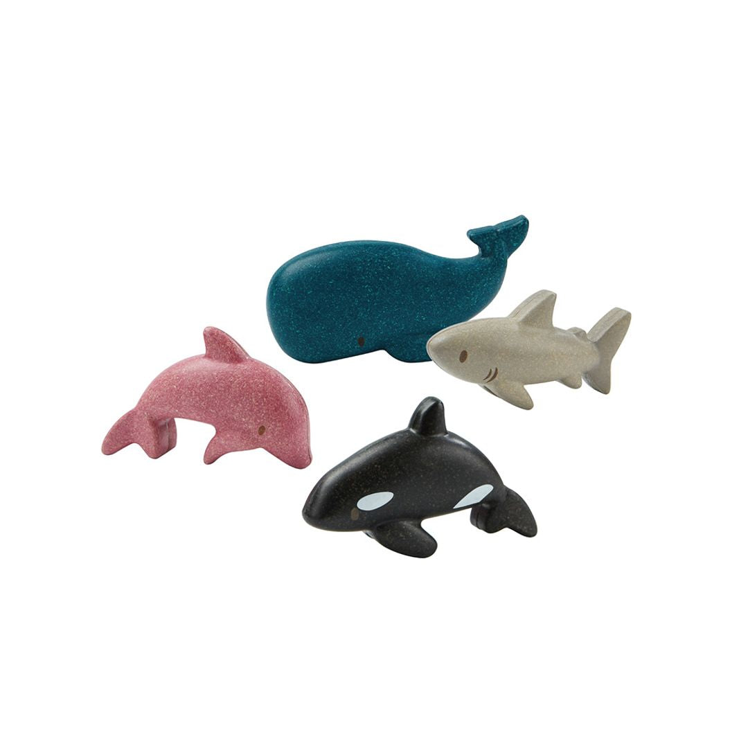 Four toy animal figures on a white background