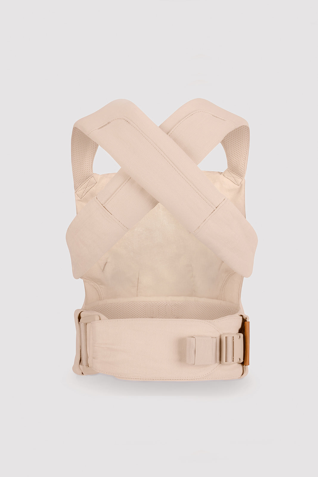 Beige baby carrier on a light gray background
