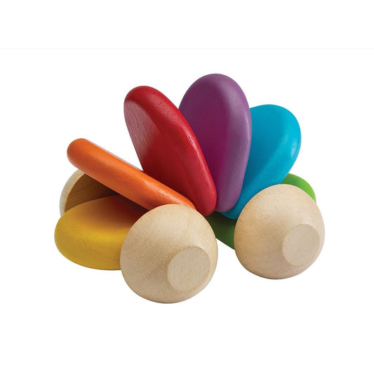 Colorful wooden toy with rainbow-colored top and natural wood bottom on a white background