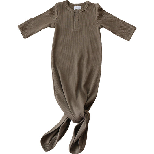 Brown baby gown on a white background