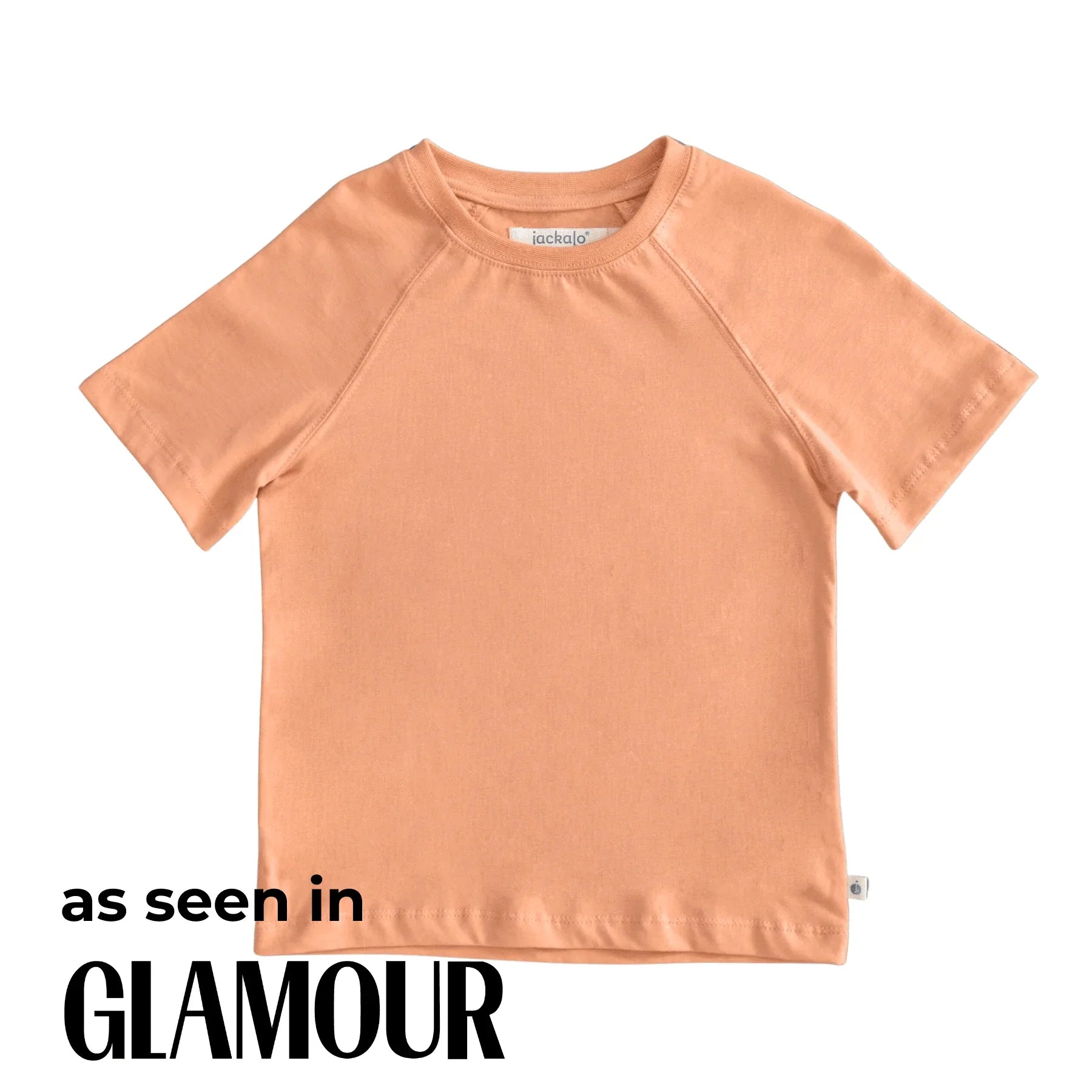 Peach-colored t-shirt on a white background with 'as seen in Glamour' text.