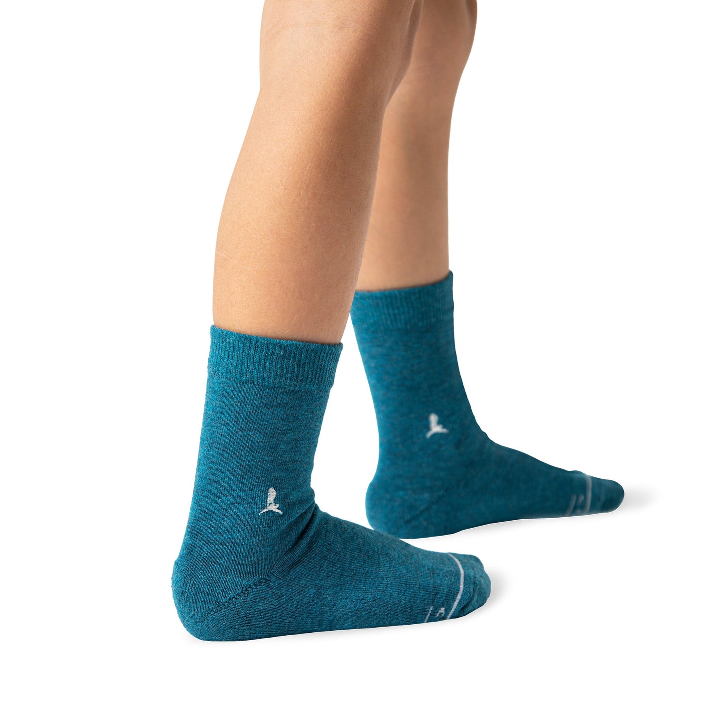 Teal socks worn by a person on a white background