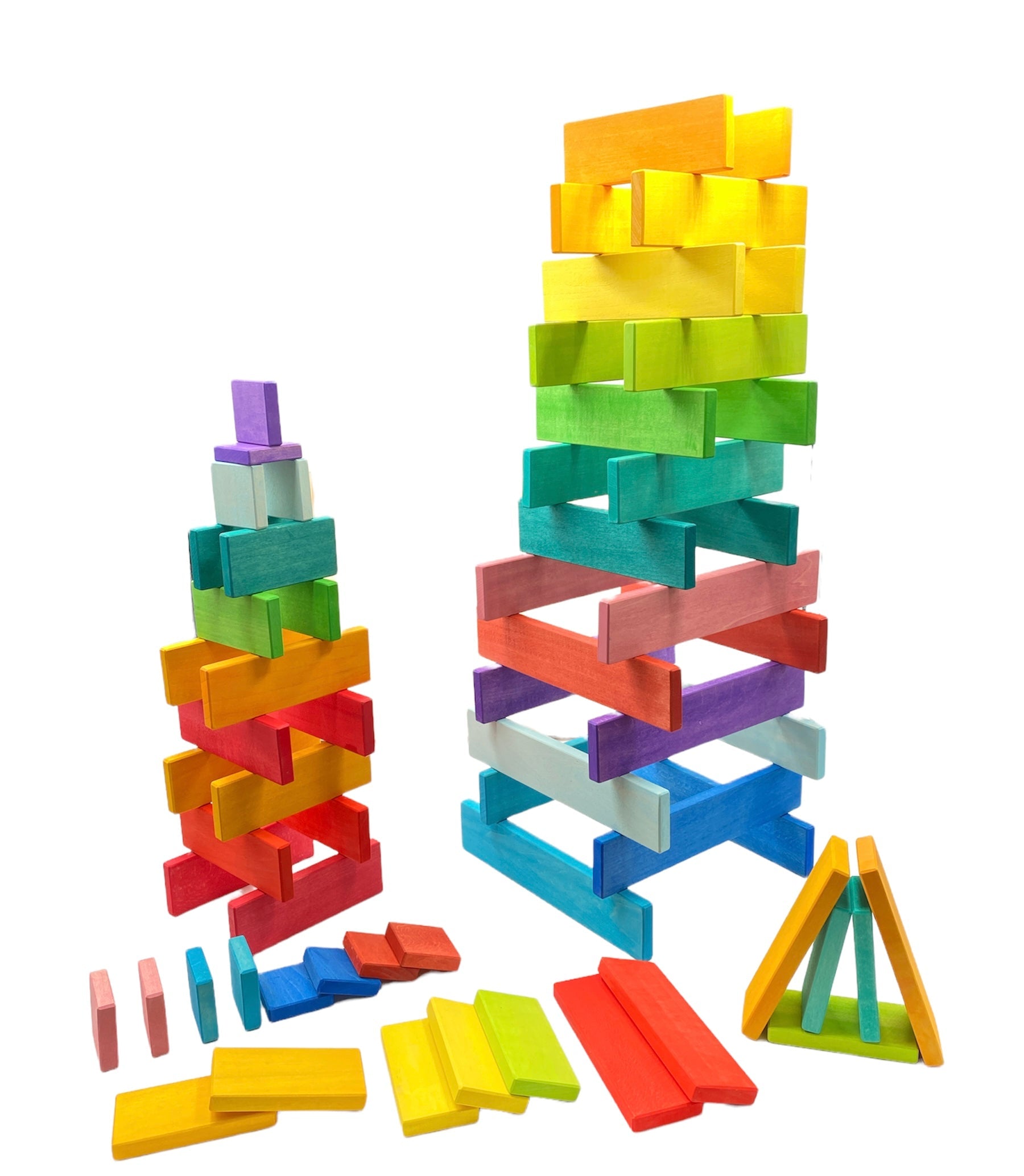 Colorful wooden blocks stacked into towers on a white background