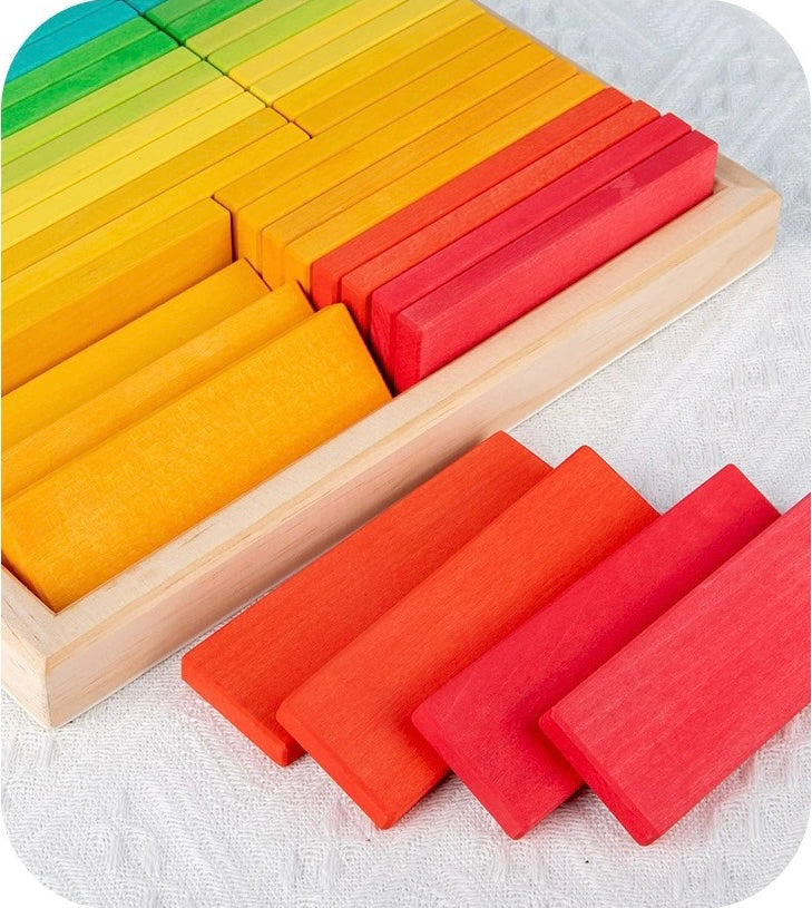 Colorful wooden blocks in a box on a white background