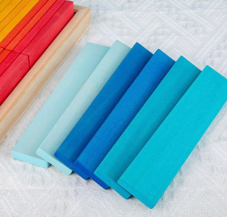 Set of colorful wooden blocks on a textured surface