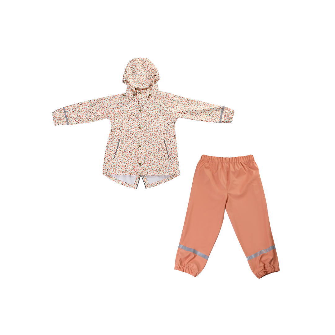 Children's raincoat and pants set with floral pattern on a white background