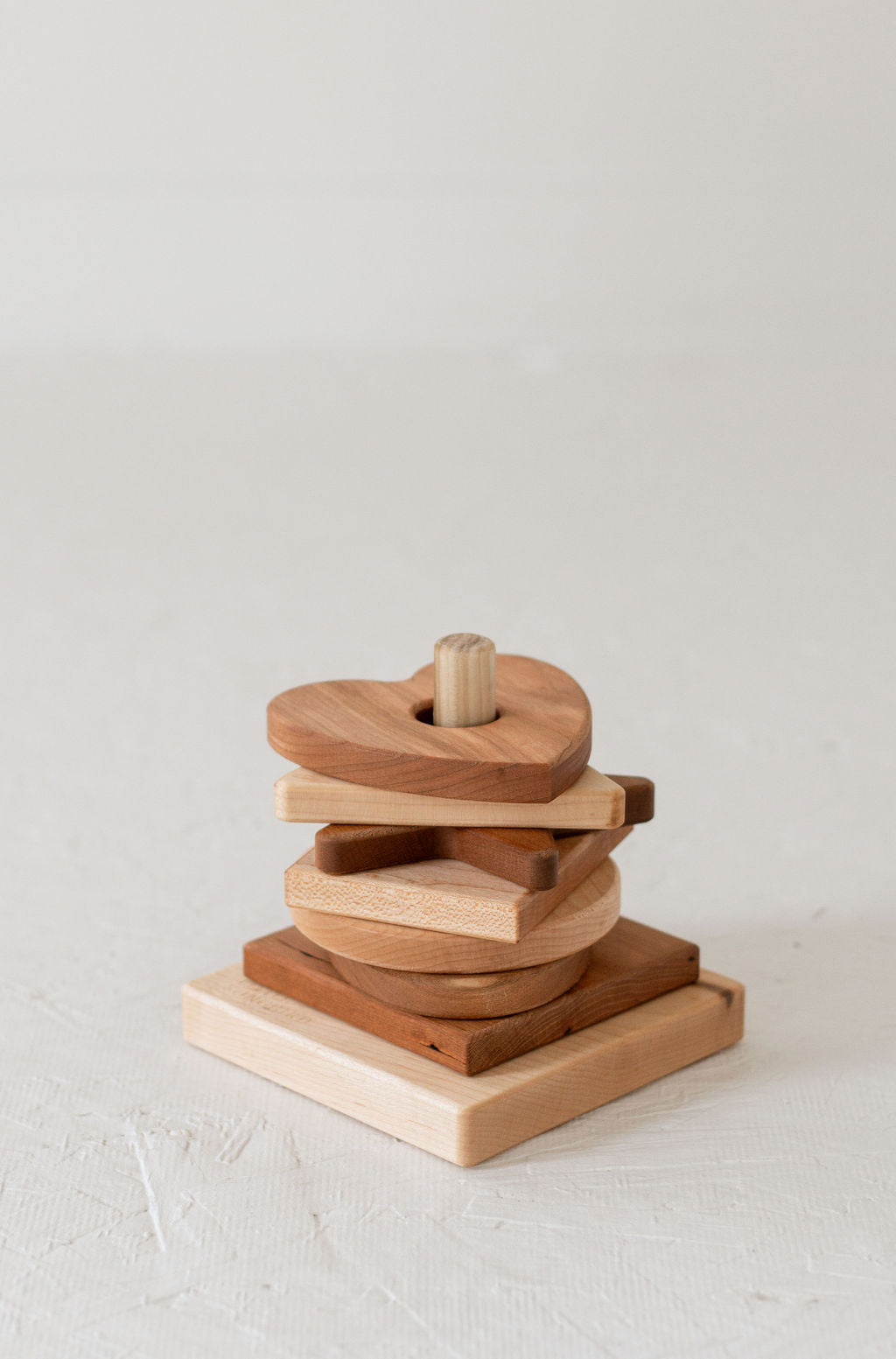 Wooden stacking toy on a light background