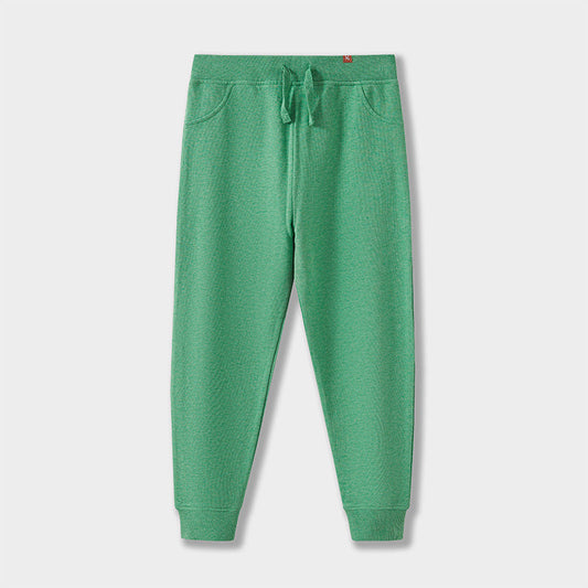 Green sweatpants on a light gray background