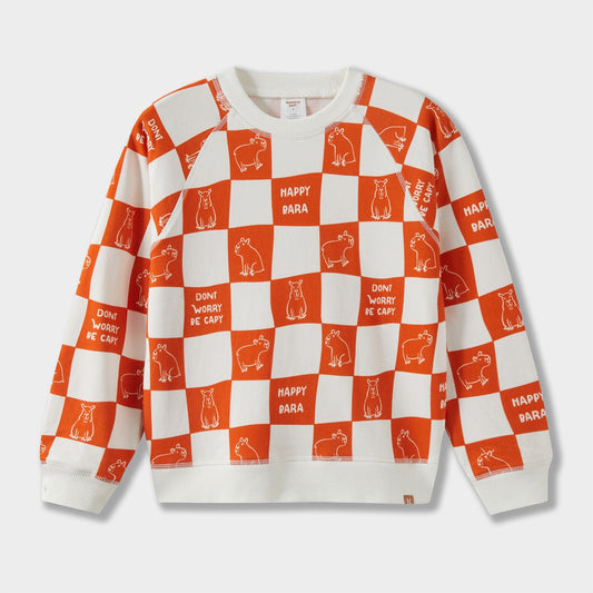 Sweatshirt with orange and white checkered pattern and text on a light gray background