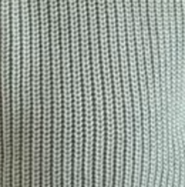 Close-up of a textured sweater fabric with in blue