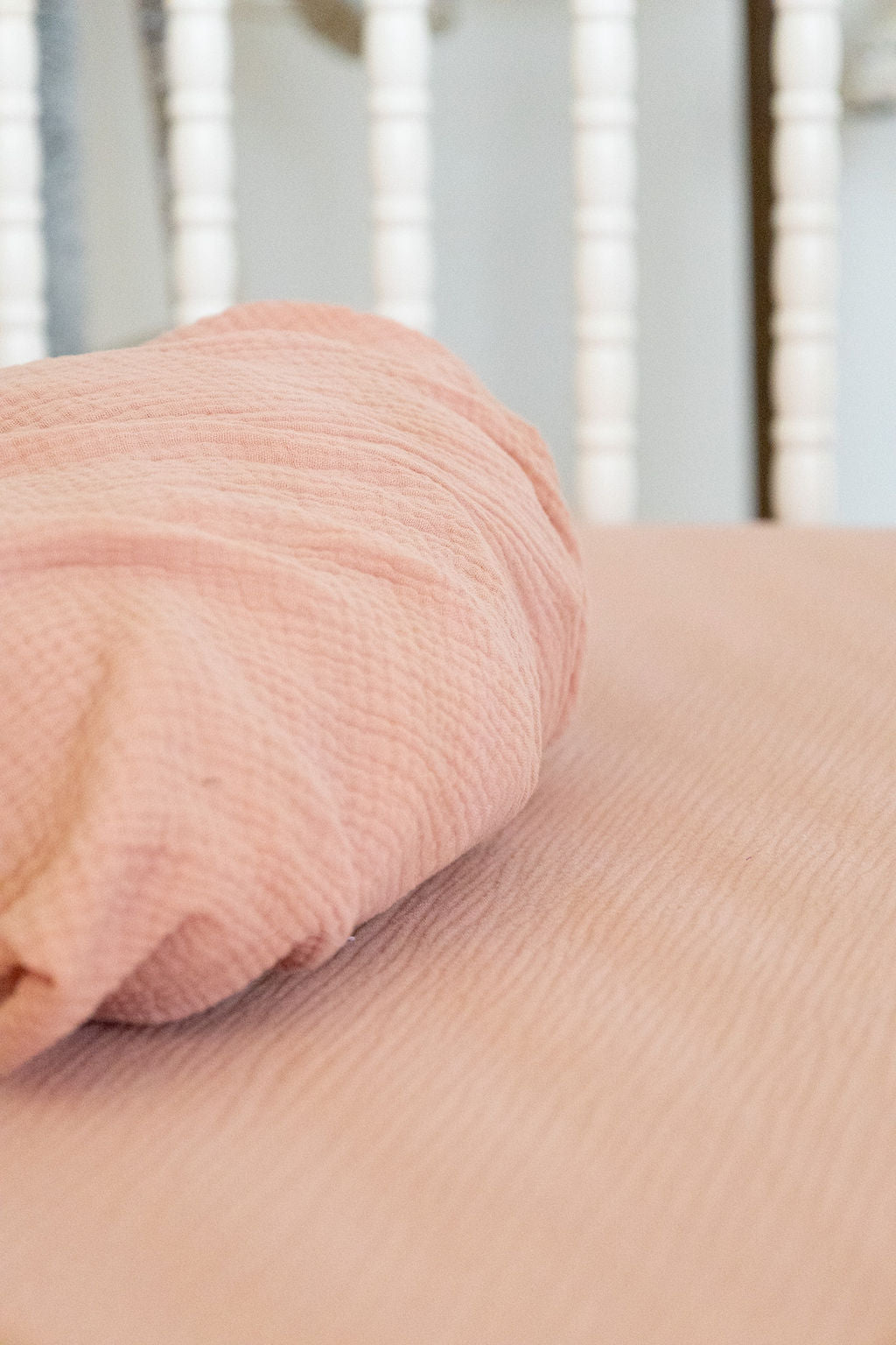 Close-up of a pink textured fabric on a blurred background