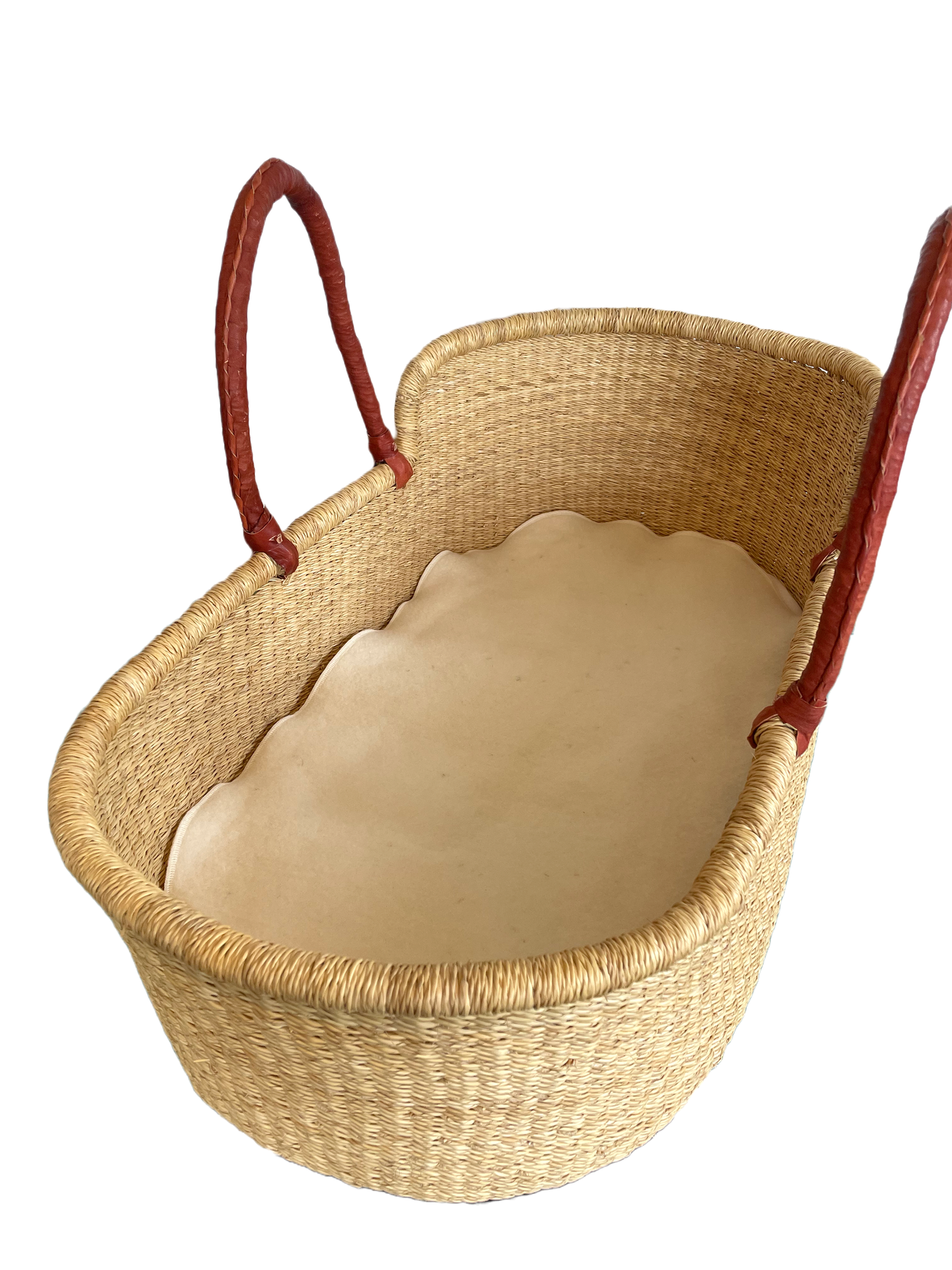 Woven basket with red handles and a beige cushion on a white background