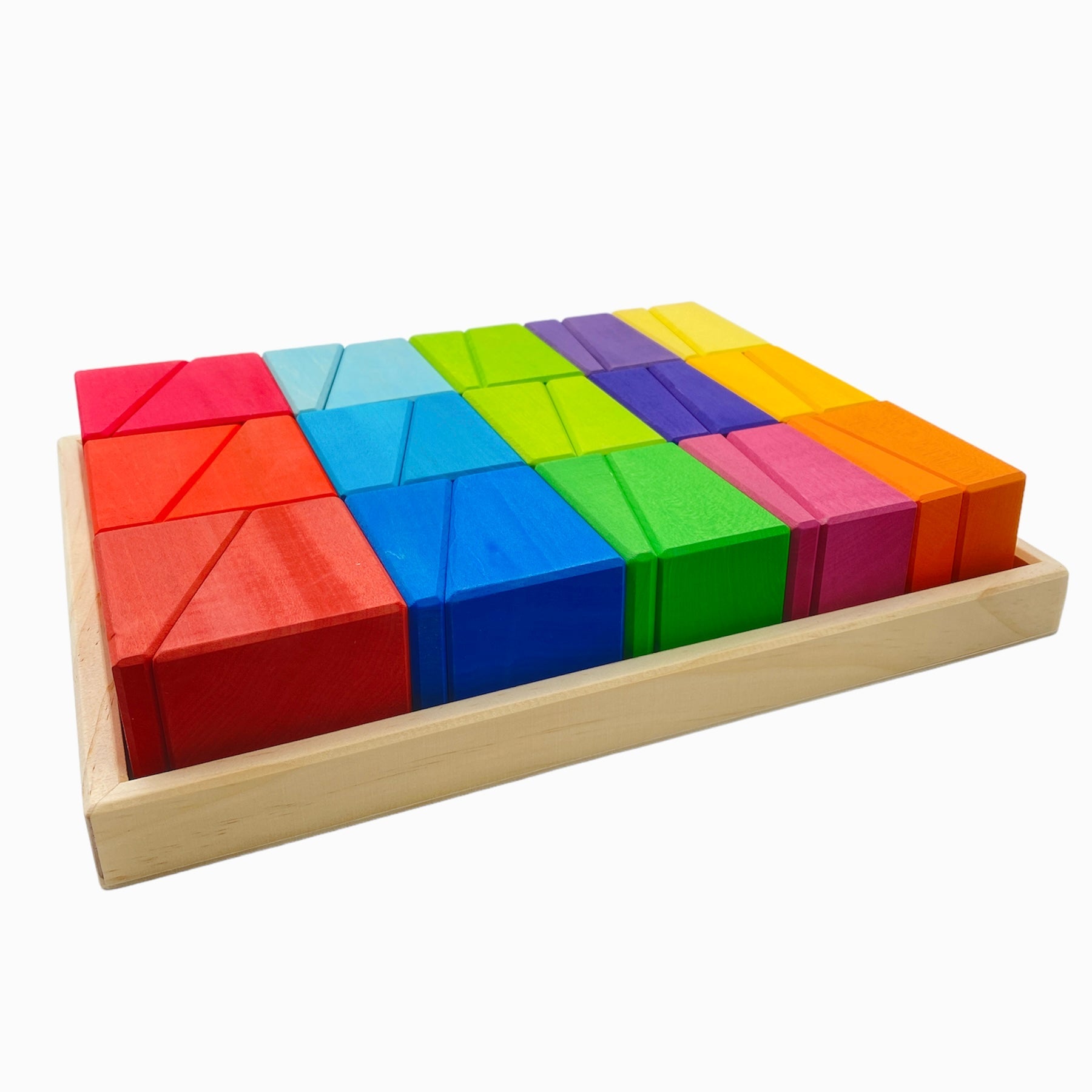 Colorful wooden blocks in a wooden tray on a white background