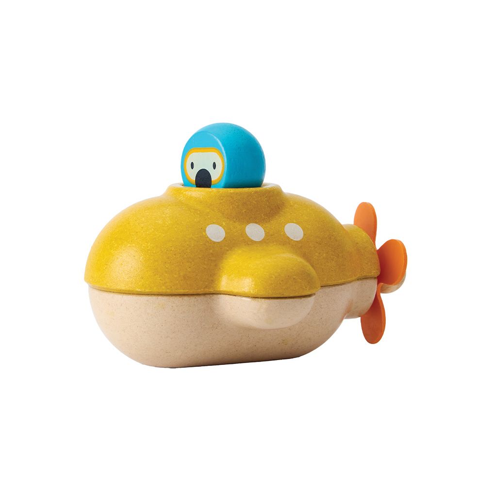 Wooden toy submarine with a blue turtle on top on a white background