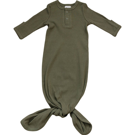 Green baby swaddle with buttons on a white background