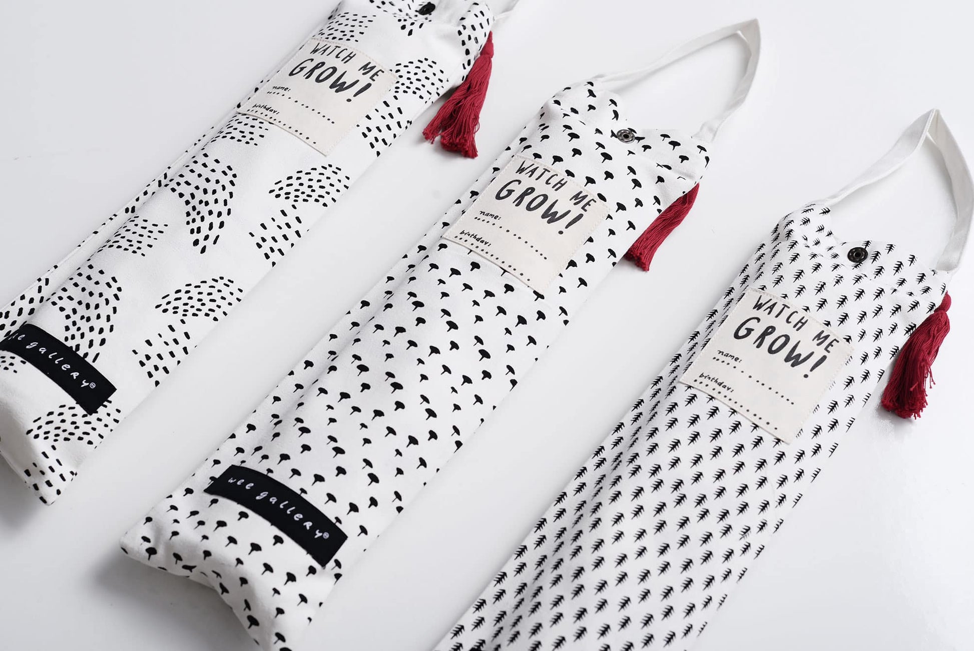 White aprons with black patterns and red tassels on a white background