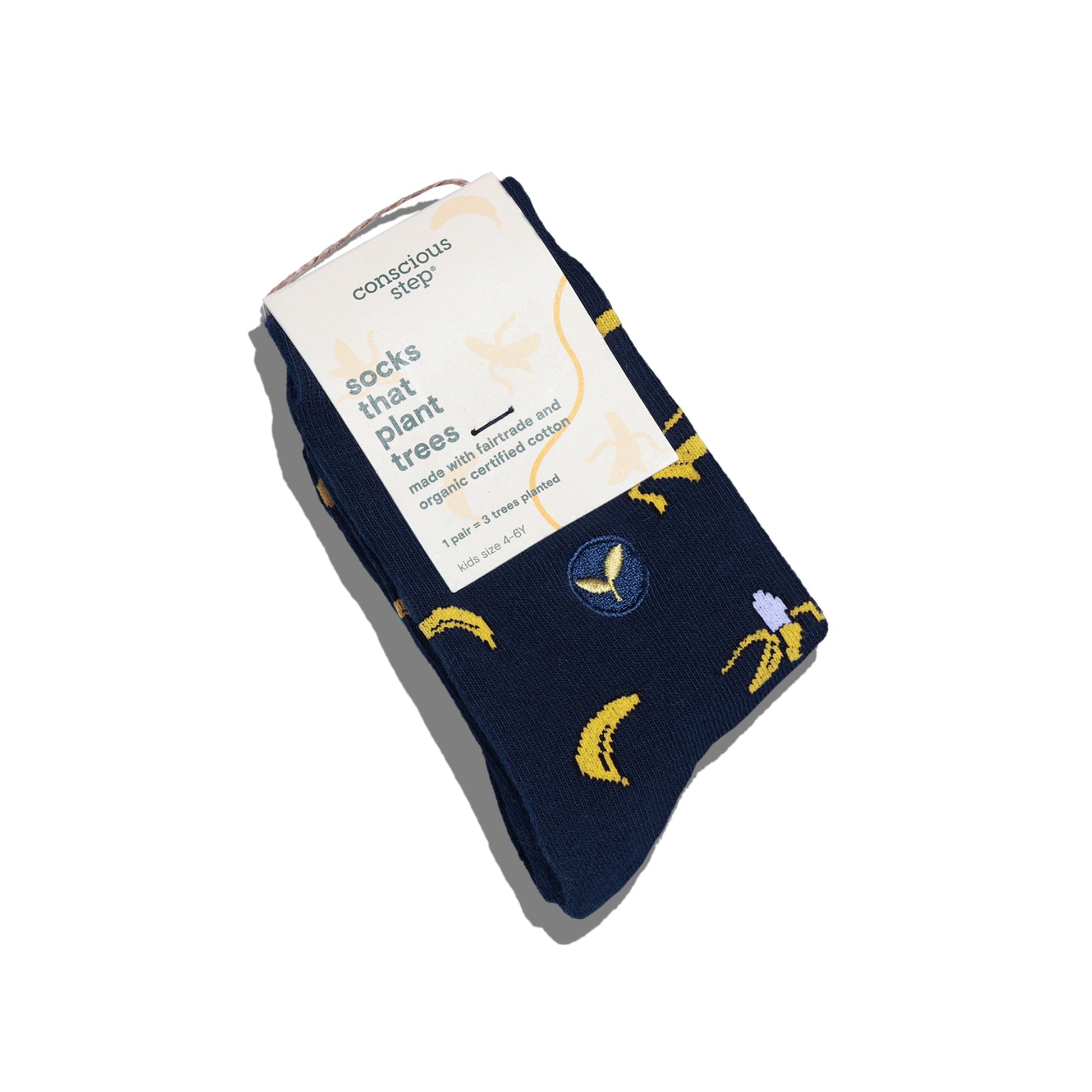 Navy blue socks with banana prints and a Conscious Step card on a white background