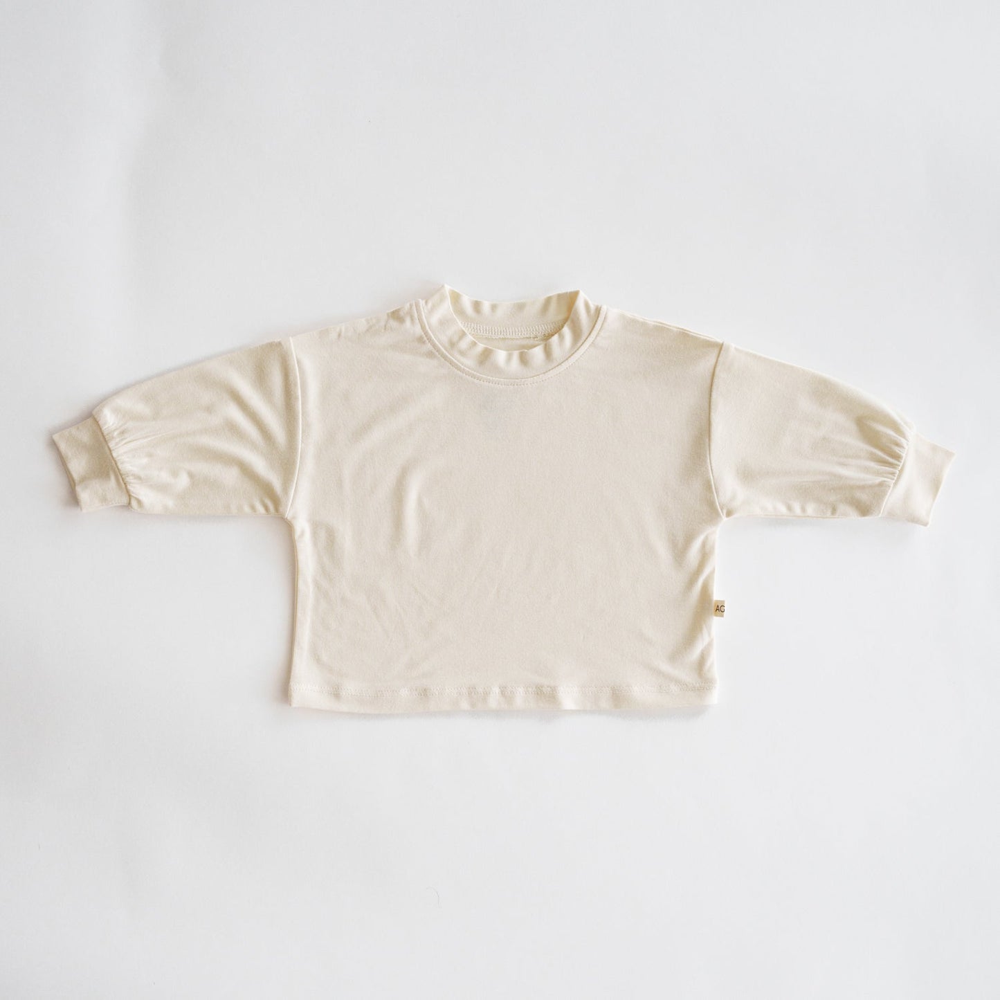 Beige long-sleeve shirt on a white background