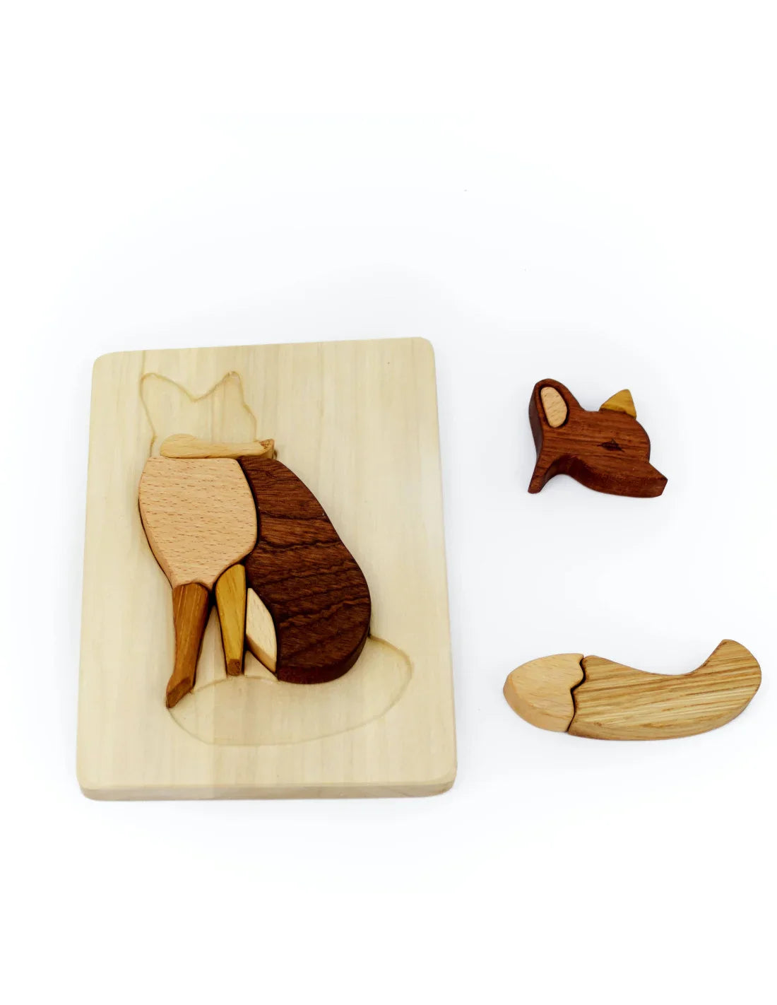 Wooden fox puzzle with pieces on a white background