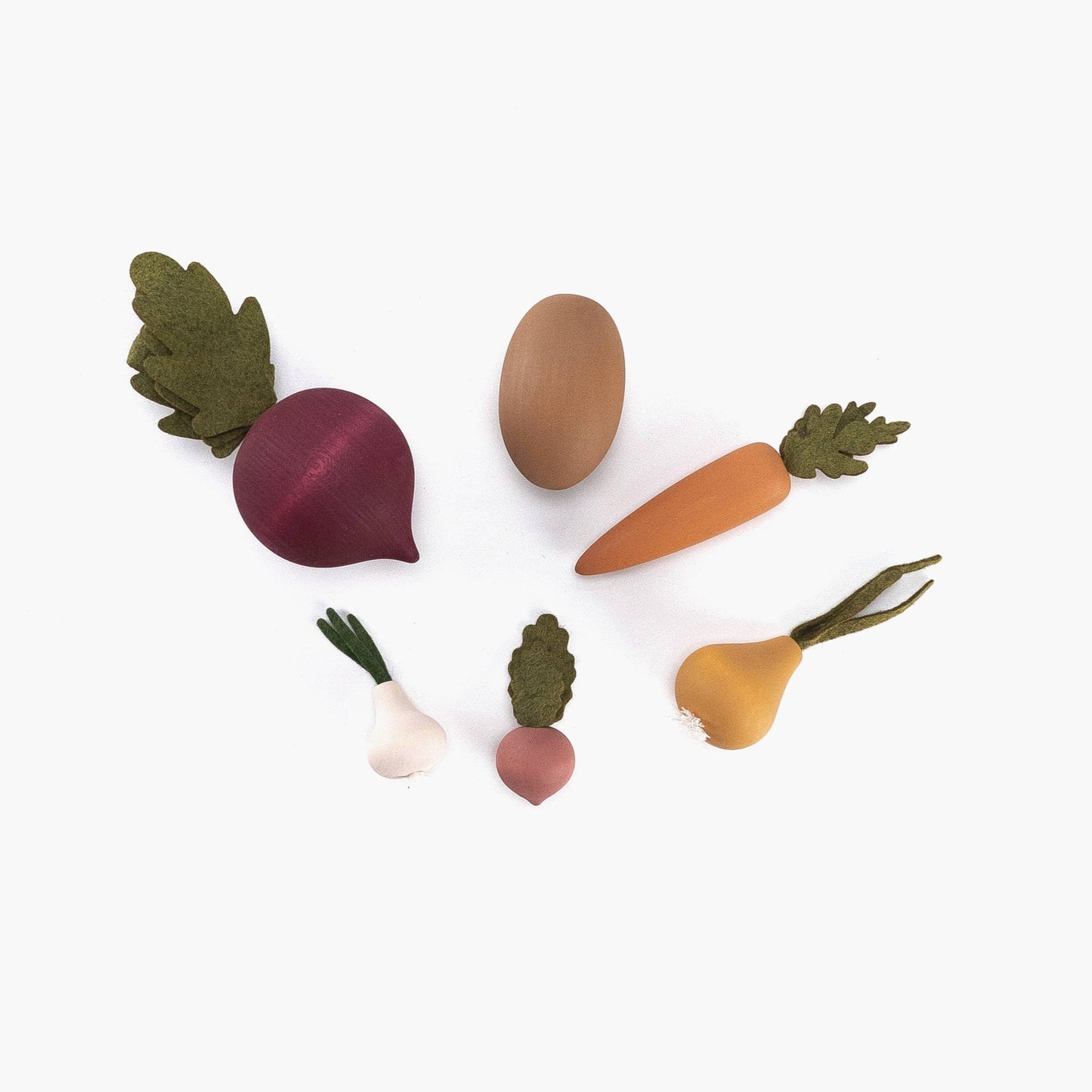 wooden vegetables set with a beet, potato, carrot, onion, garlic, and radish