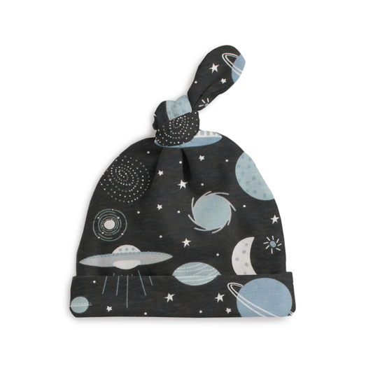 Baby hat with space-themed design on a white background