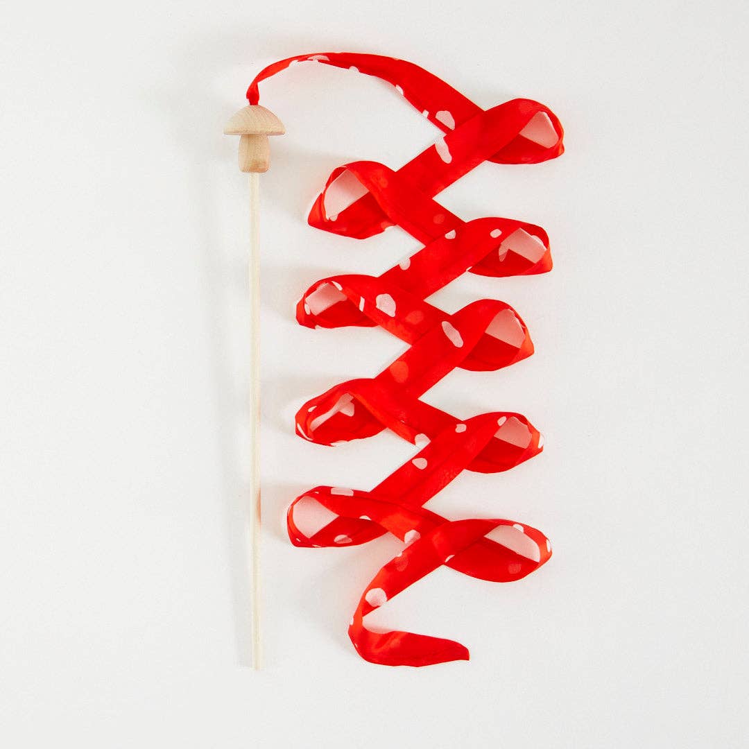 Red  mushroom streamer wand on a white background