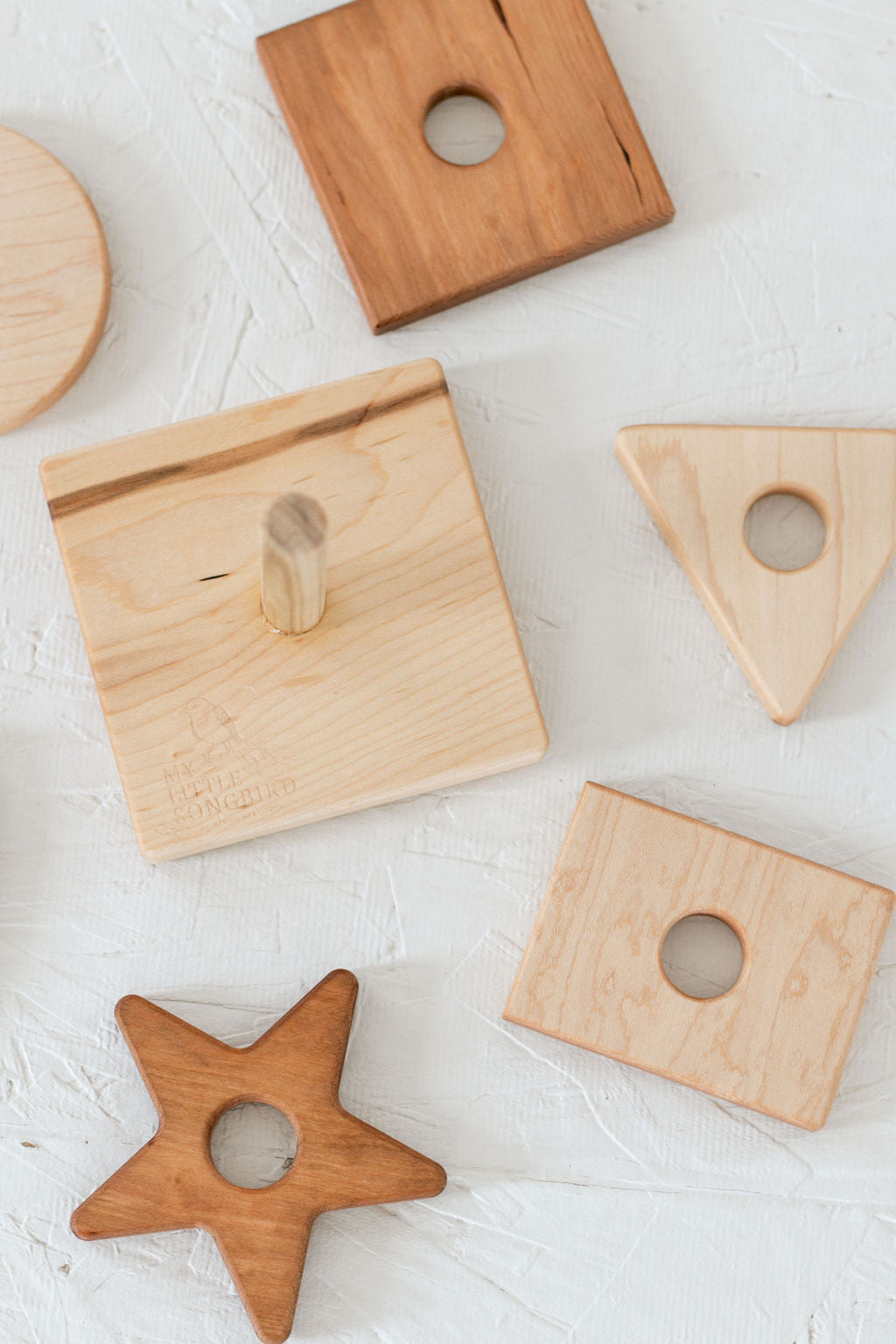 Wooden geometric shapes on a light surface