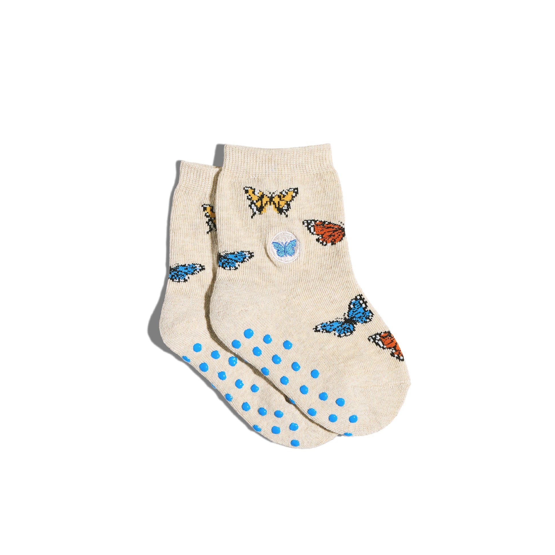 Beige socks with butterfly designs and blue polka dots on a white background