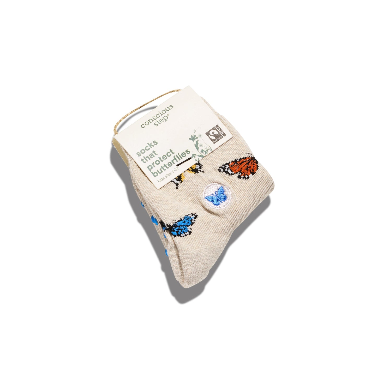 Pair of socks with butterfly designs on a beige background