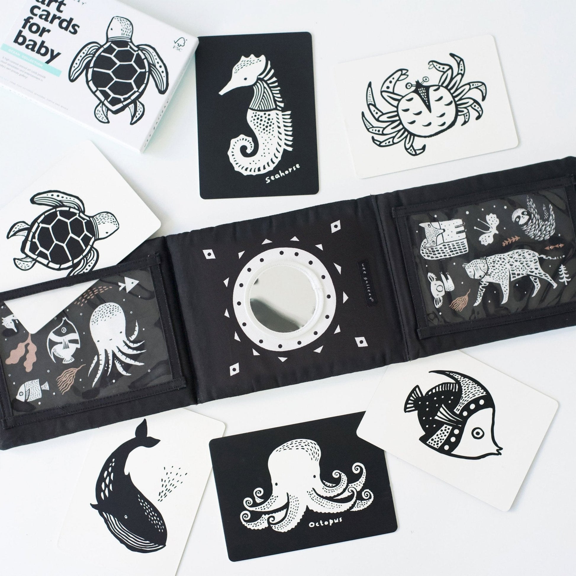 Black and white illustrated cards with various sea creatures on a white background