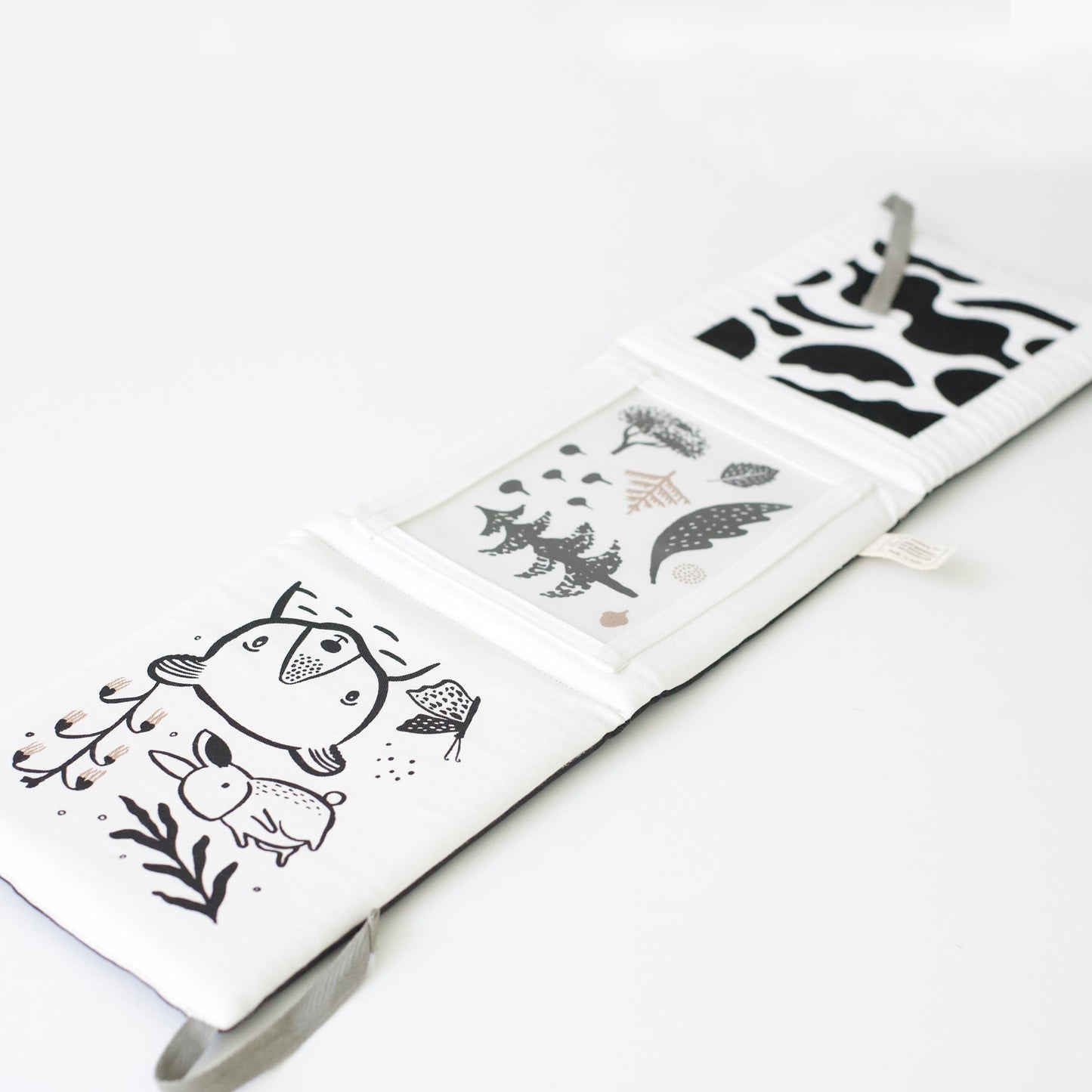 Children's book with black and white animal illustrations on a white background