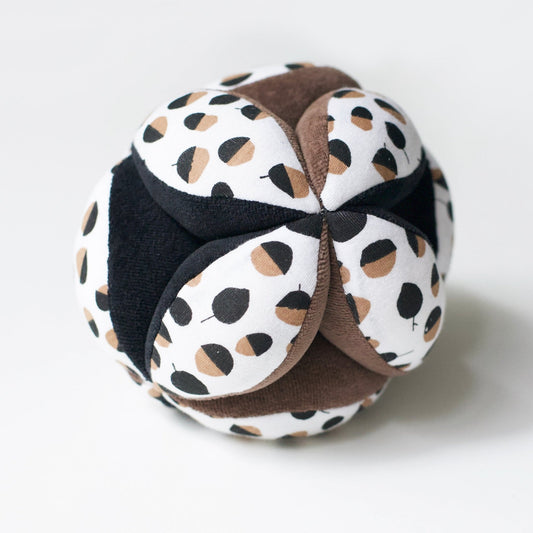 Plush toy with patterned design on a white background