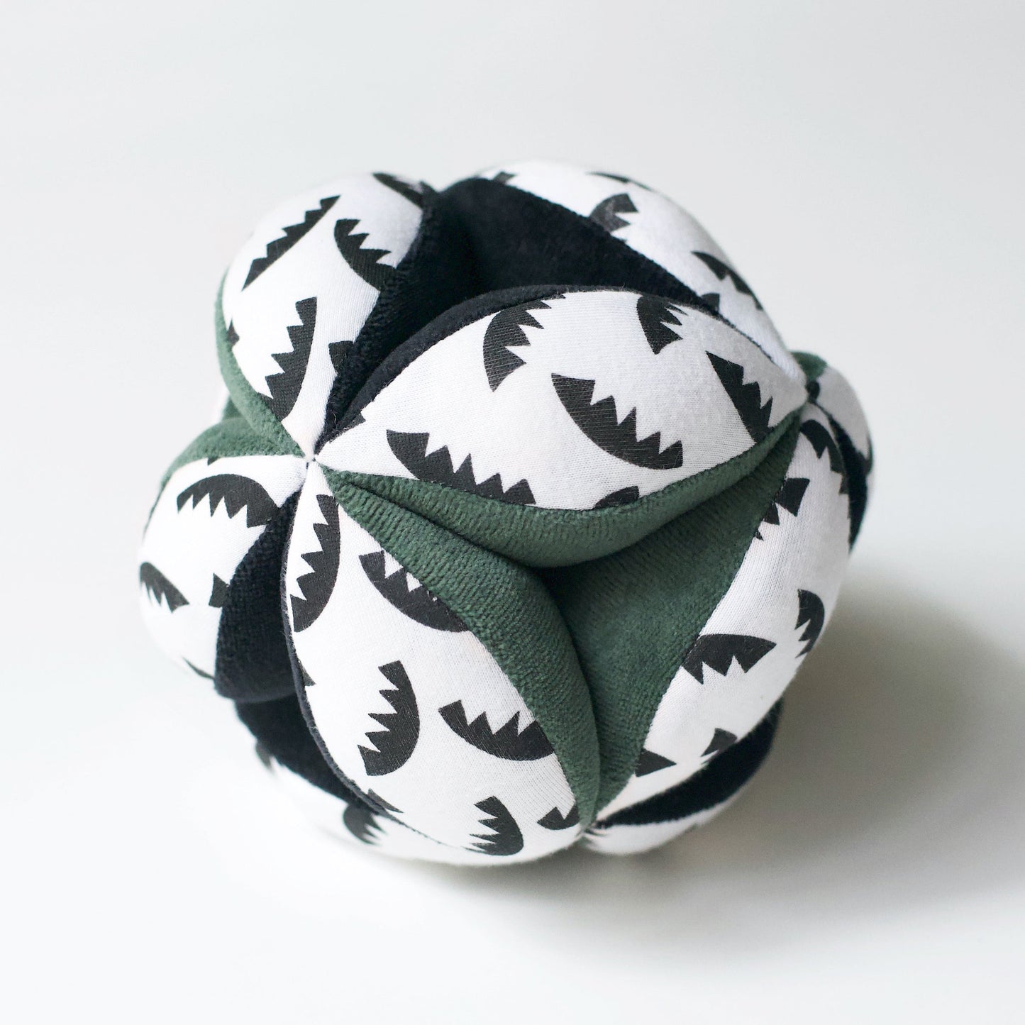 Folded fabric with black and white pattern on a white background