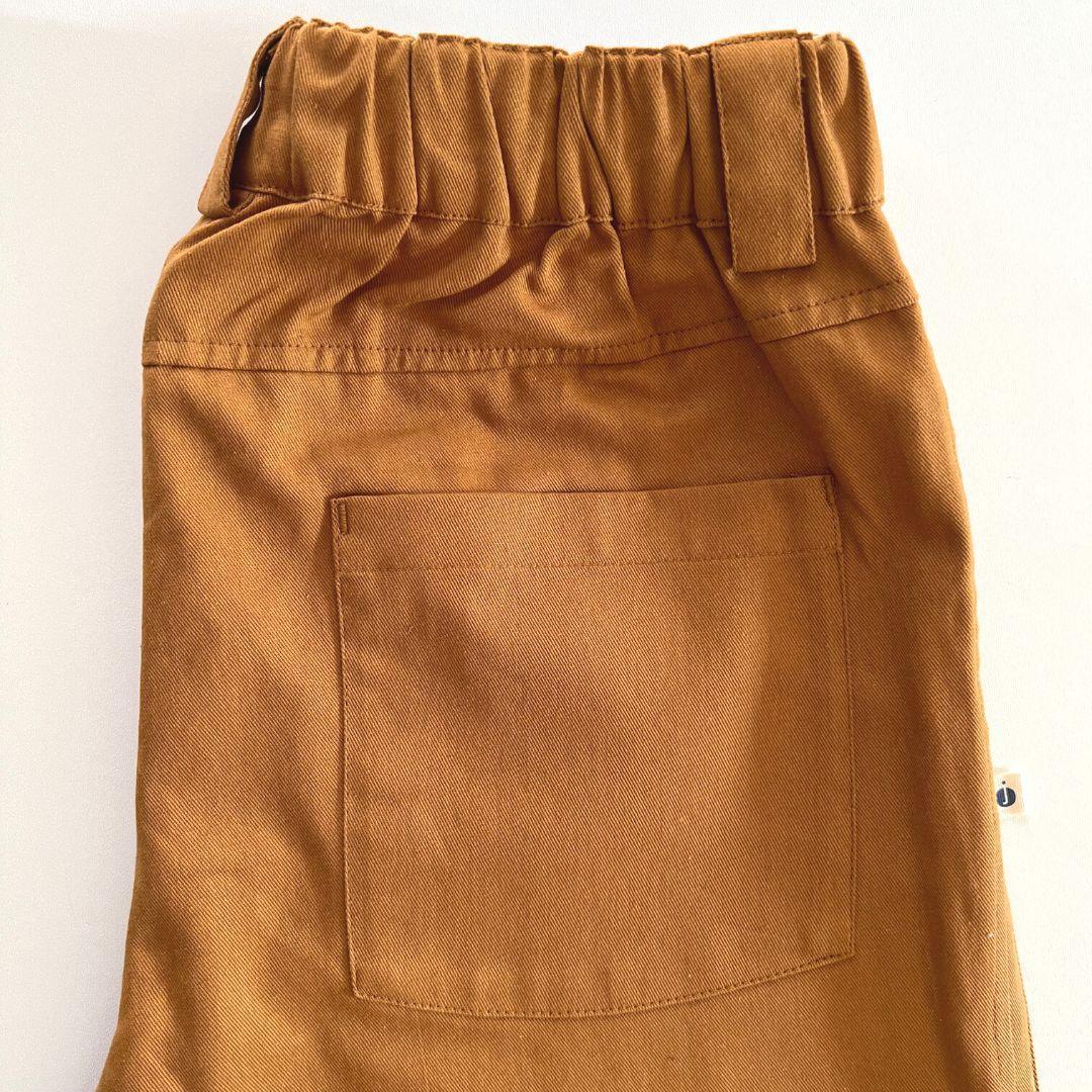 Brown pants with a pocket on a white background